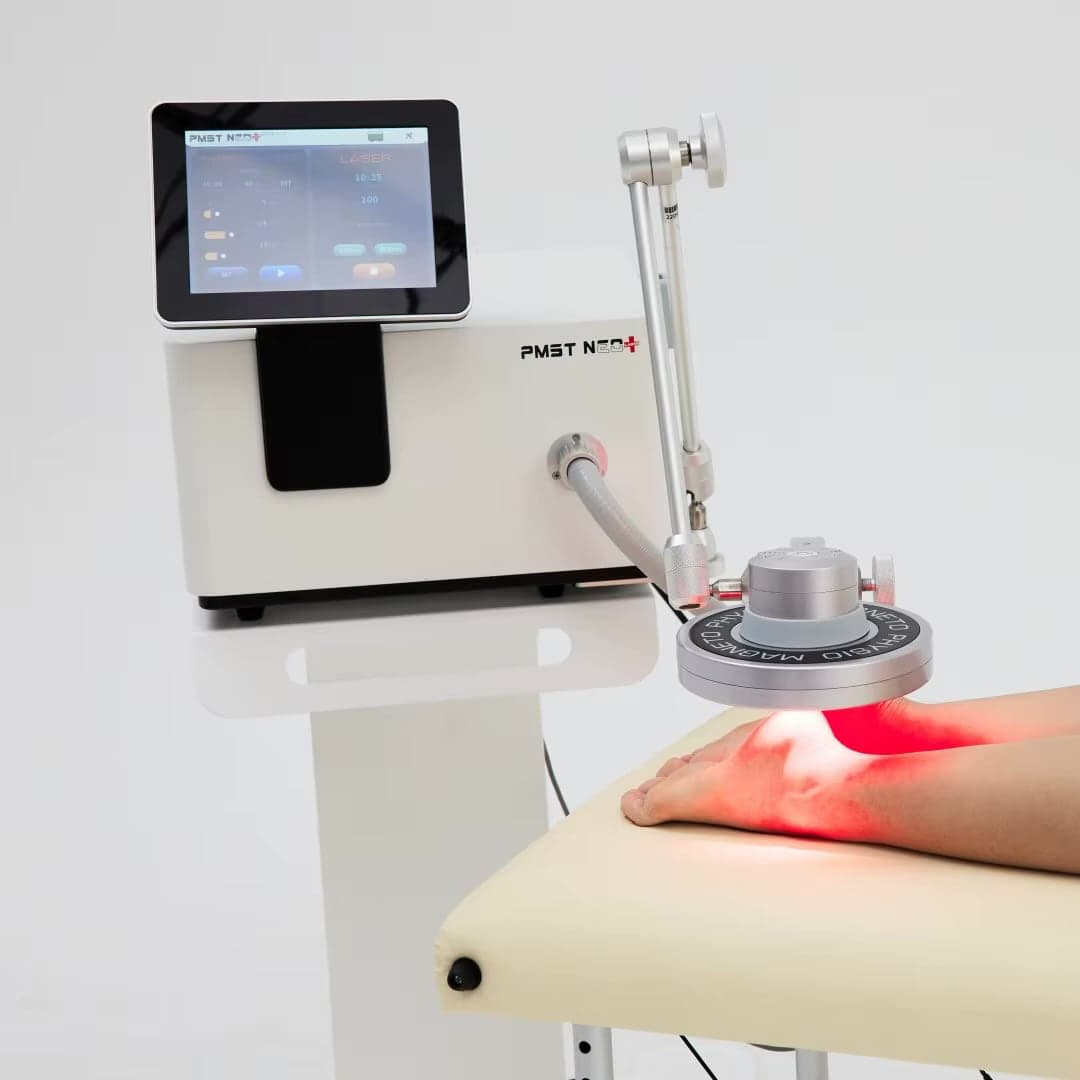 The PMST NEO magnetic stimulator with its laser applied to a foot